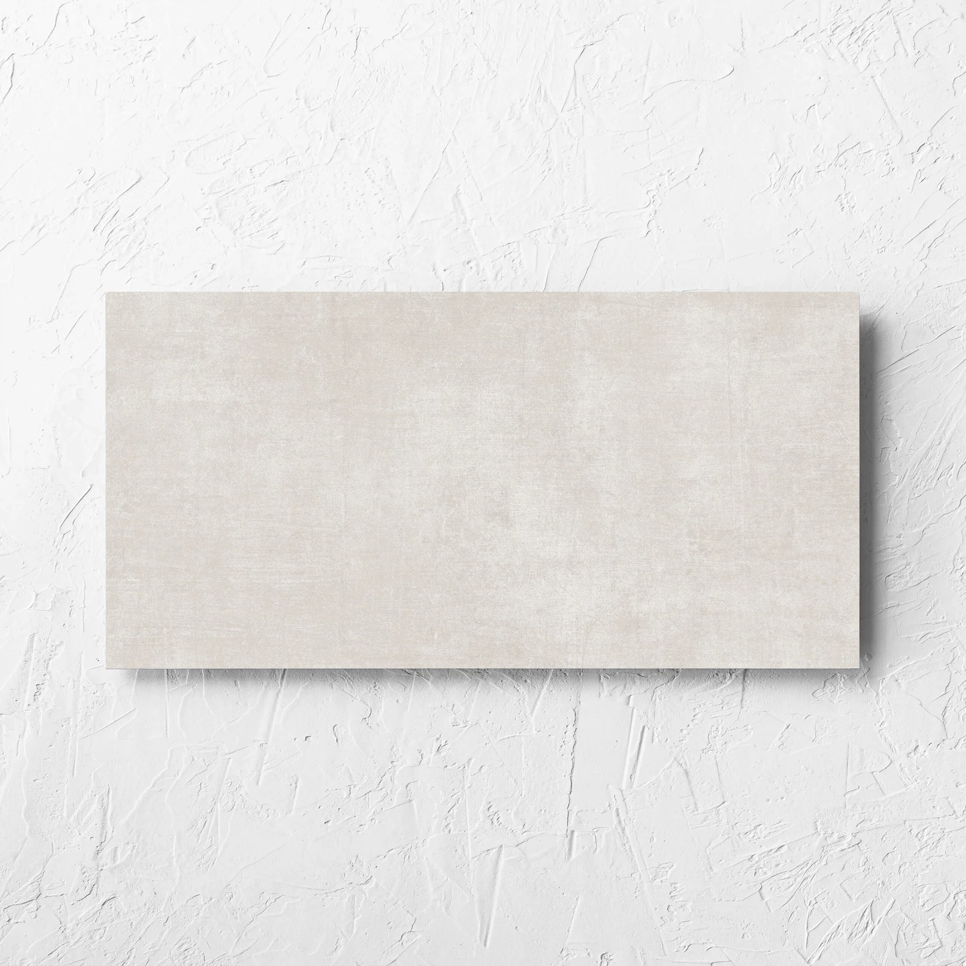 Bayside Champagne Natural Matt 300x600mm tile laid flat on a white rendered wall, showing the matt surface