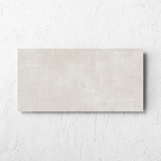 Bayside Champagne Natural Matt 300x600mm tile laid flat on a white rendered wall, showing the matt surface