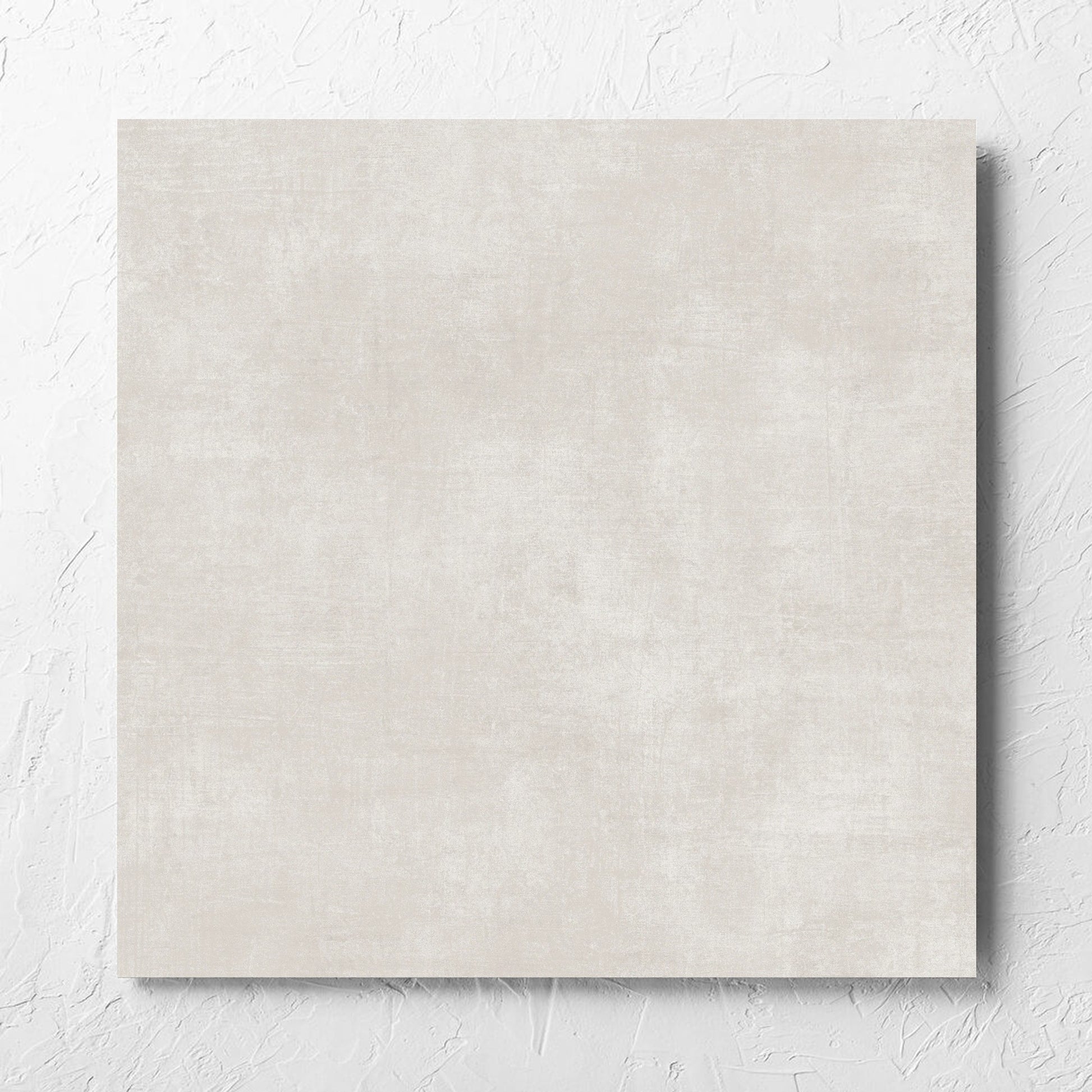 Bayside Champagne Natural Matt 600x600mm tile laid flat on a white rendered wall, showing the matt surface