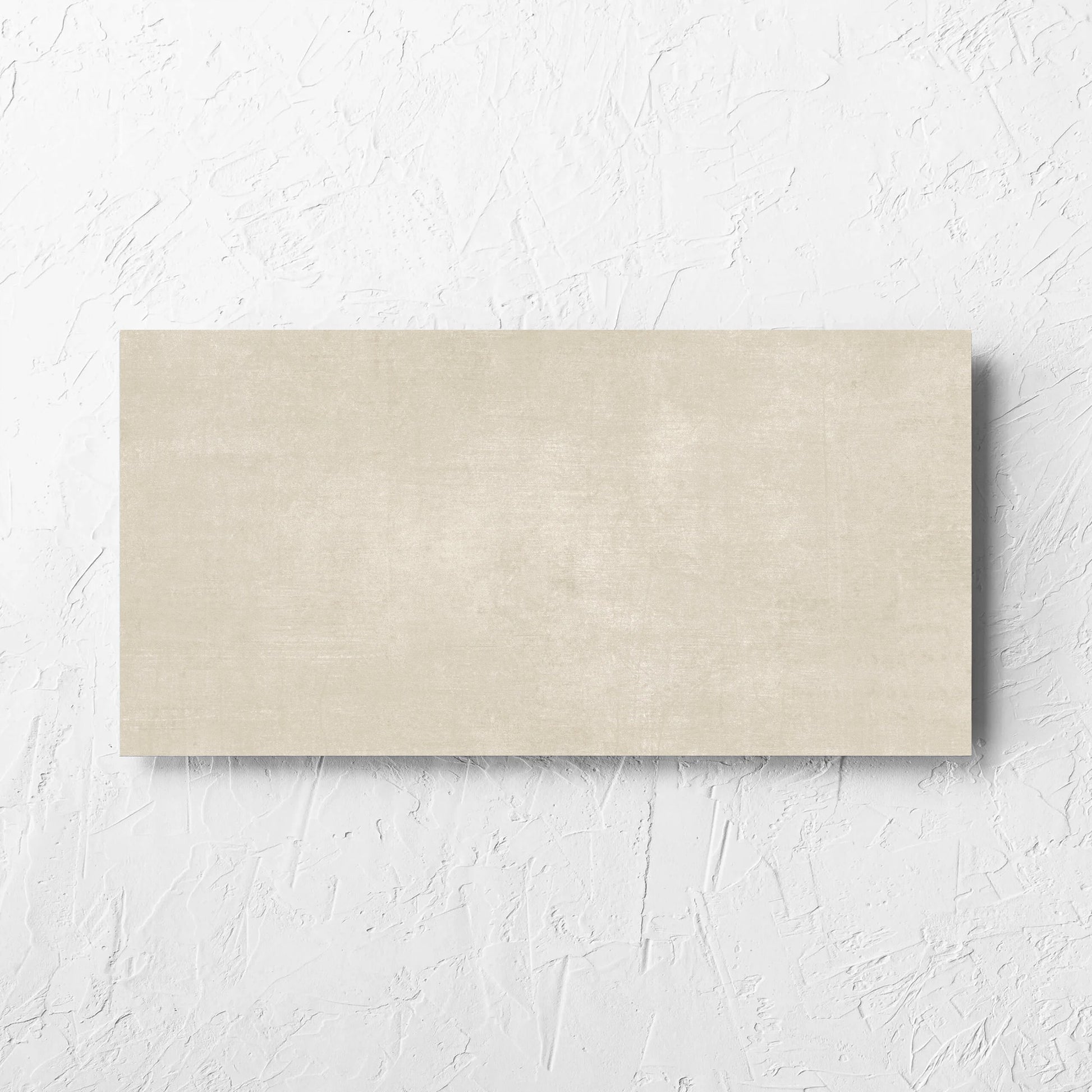 Bayside Sand Natural Matt 300x600mm tile laid flat on a white rendered wall, showing the matt surface
