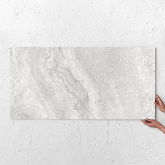 Vatican Silver Vein Cut Travertine Matt 600x1200mm tile with hands