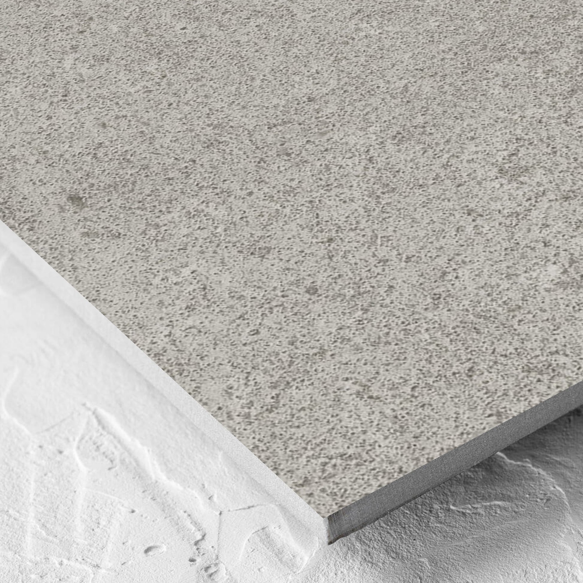 Corner close-up of the Beachstone Grey Grip 600x600x20mm tile showing the matt surface and the edge profile