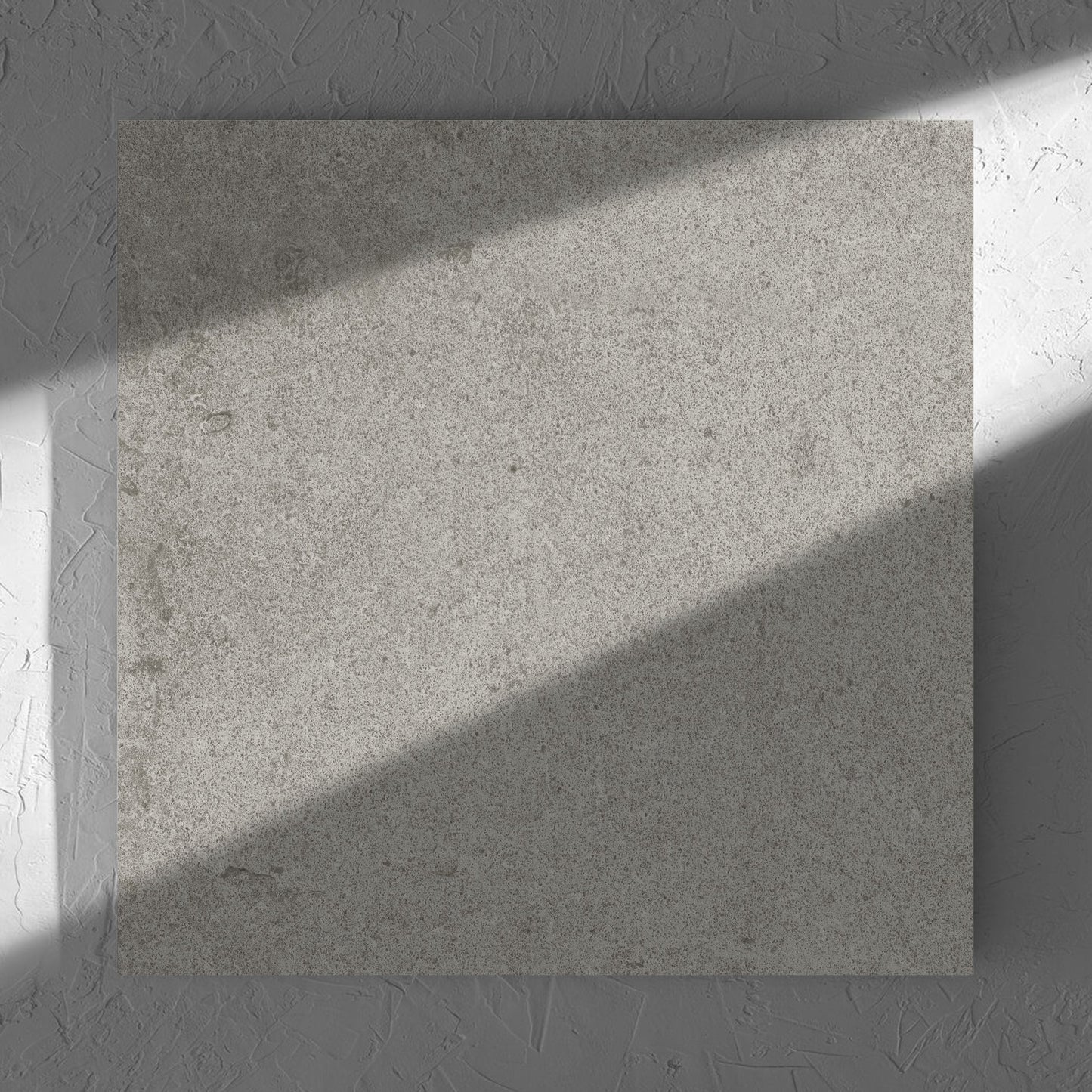 Beachstone Grey Grip 600x600x20mm tile in soft natural window light, showing the matt surface