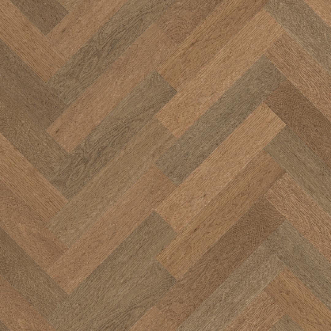Close-up texture shot of Beige Ash iDesign Herringbone Flooring 15/3mm showing warm beige and grey-toned oak wood planks in a classic diagonal herringbone pattern.