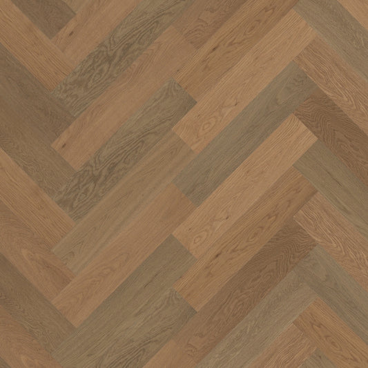 Close-up texture shot of Beige Ash iDesign Herringbone Flooring 15/3mm showing warm beige and grey-toned oak wood planks in a classic diagonal herringbone pattern.