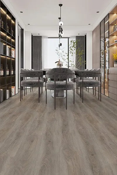 Beige Sand Elegant SPC Hybrid 6.5mm Flooring 5+1.5mm installed in a modern dining room with grey velvet chairs, pendant light, and built-in shelving.