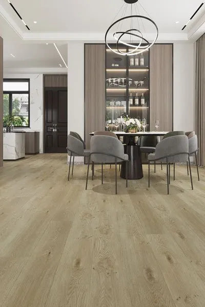 Bianco Urban Laminate 12mm Flooring 12mm installed in a modern dining room with grey upholstered chairs, black round table, and pendant chandelier.