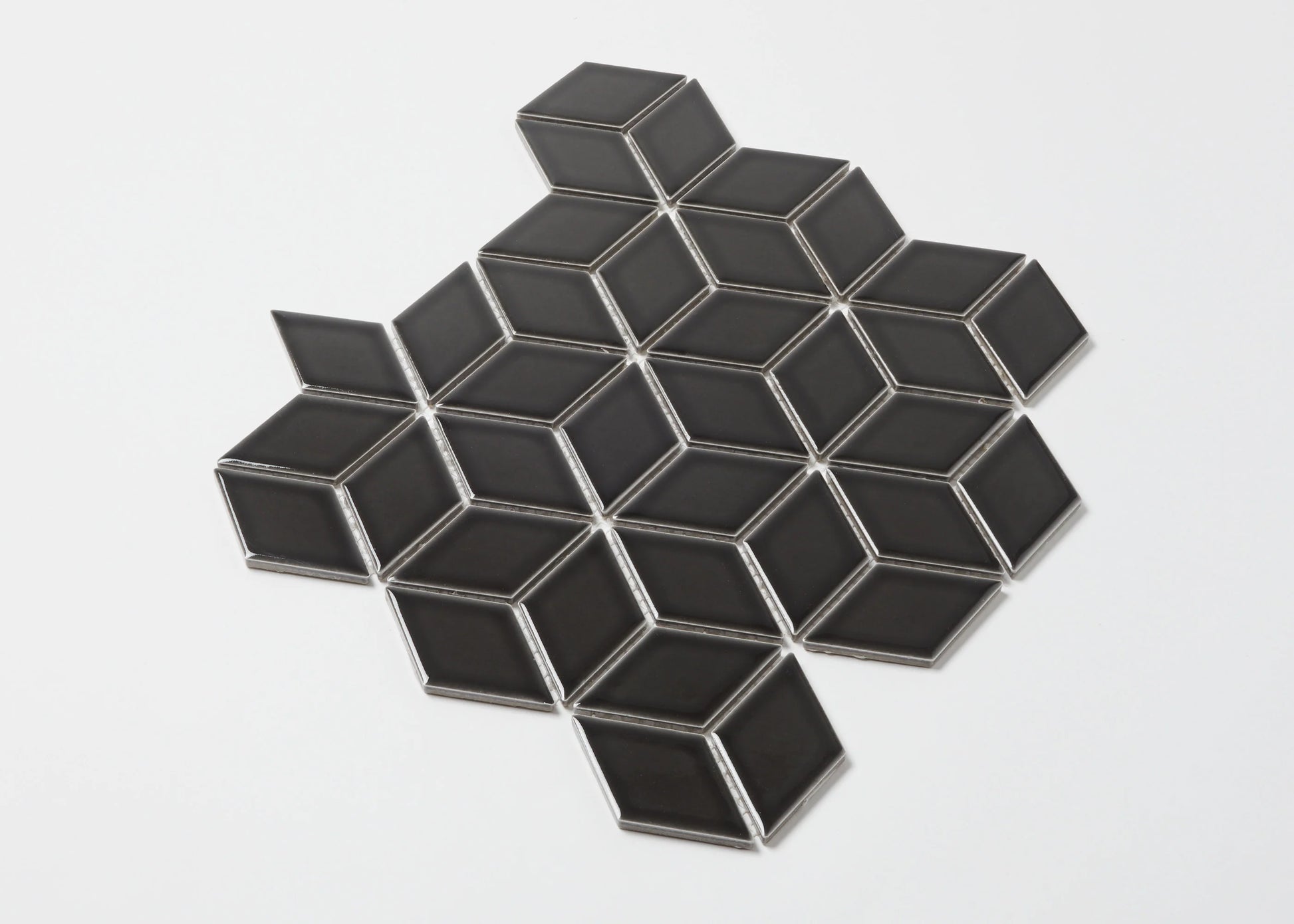 Pack shot of Black Gloss Cube 48x48mm ceramic mosaic tiles arranged in a diamond rhombus pattern with silver grout lines on a white background.