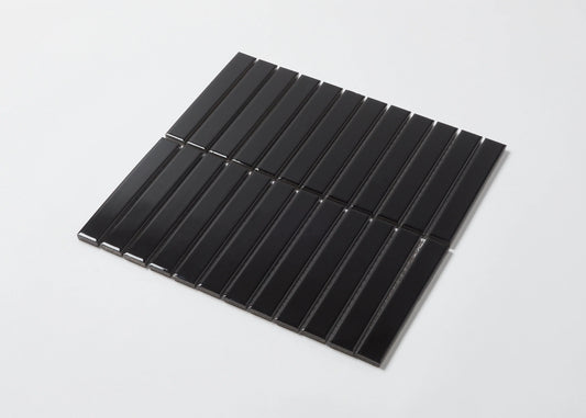 Pack shot of Black Gloss KitKat Straight Bone Pattern 22x145mm tiles arranged in vertical parallel strips on a white background.