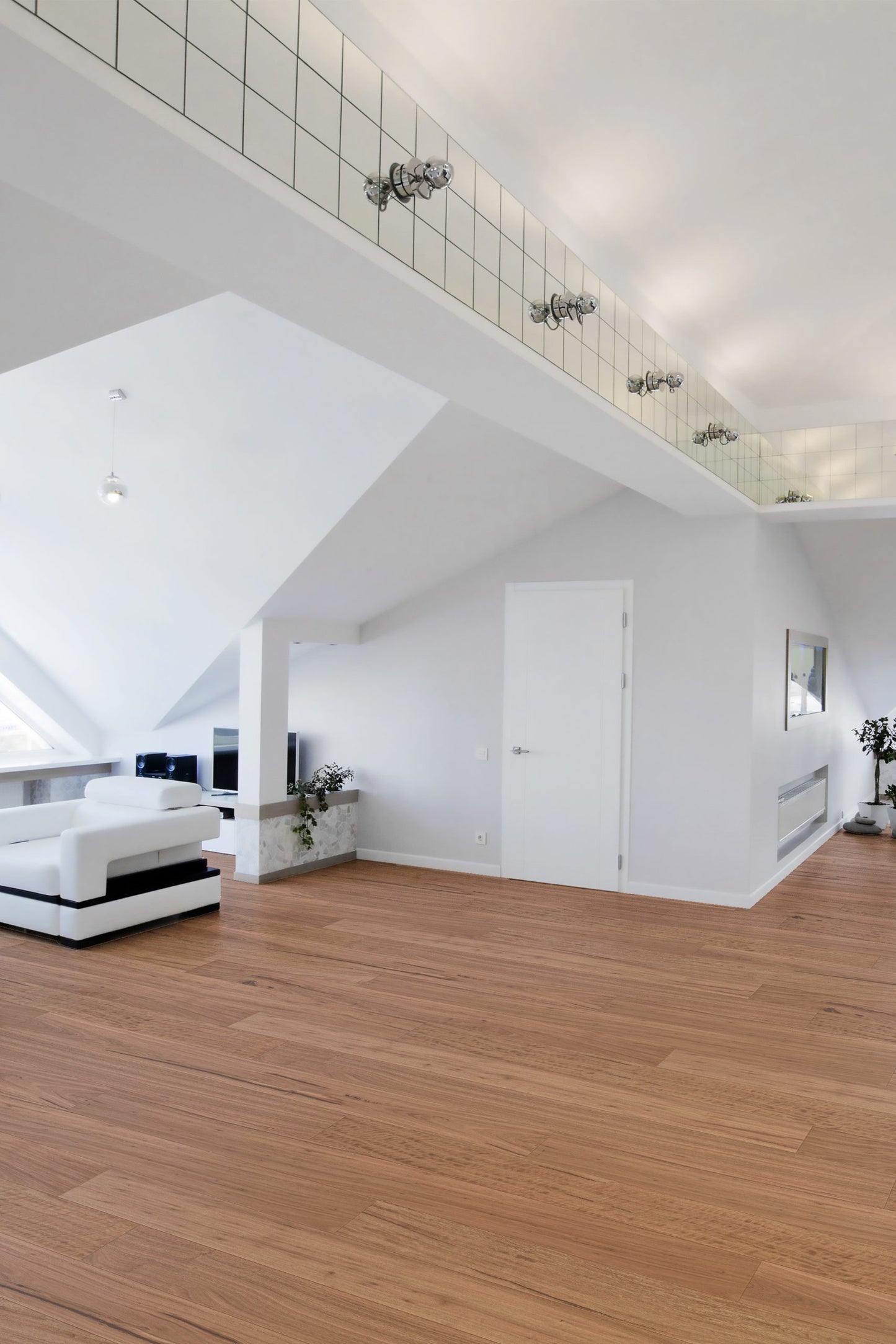 Blackbutt Engineered Australian Classic Flooring 14/3mm installed in a bright open-plan loft living space with white sofa and vaulted ceilings.