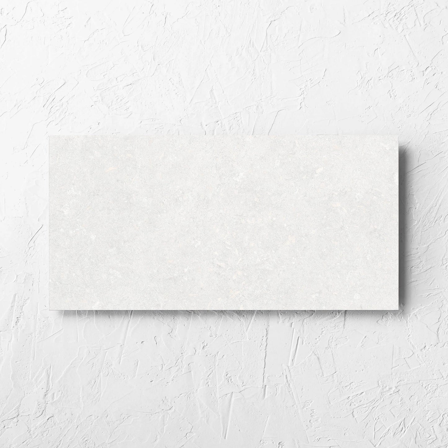 Brighton Bianco 3D Decor 300x600mm tile laid flat on a white rendered wall, showing the matt surface