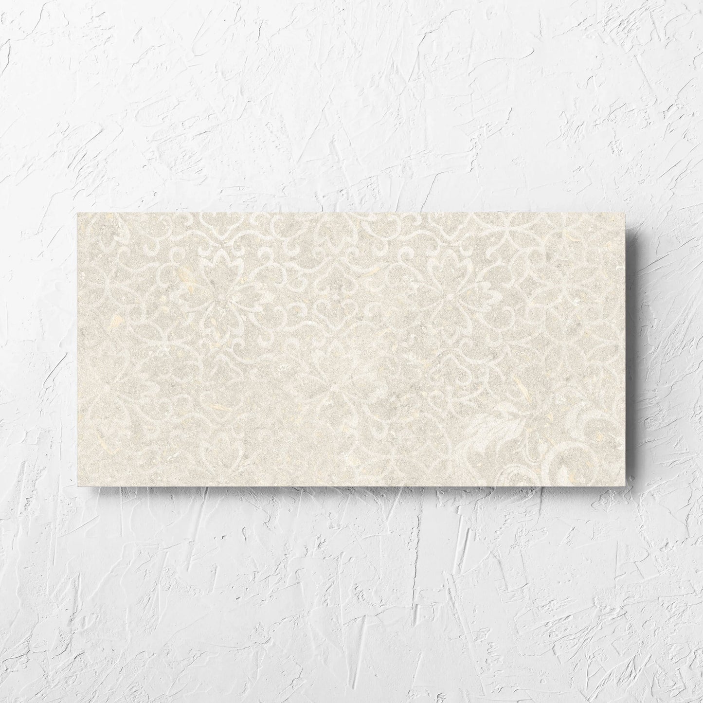 Brighton Earth 3D Decor 300x600mm tile laid flat on a white rendered wall, showing the matt surface