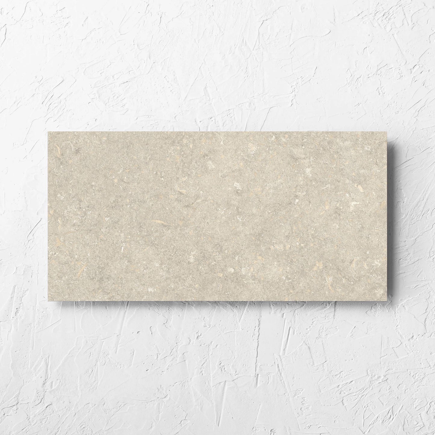 Brighton Earth Matt 300x600mm tile laid flat on a white rendered wall, showing the matt surface