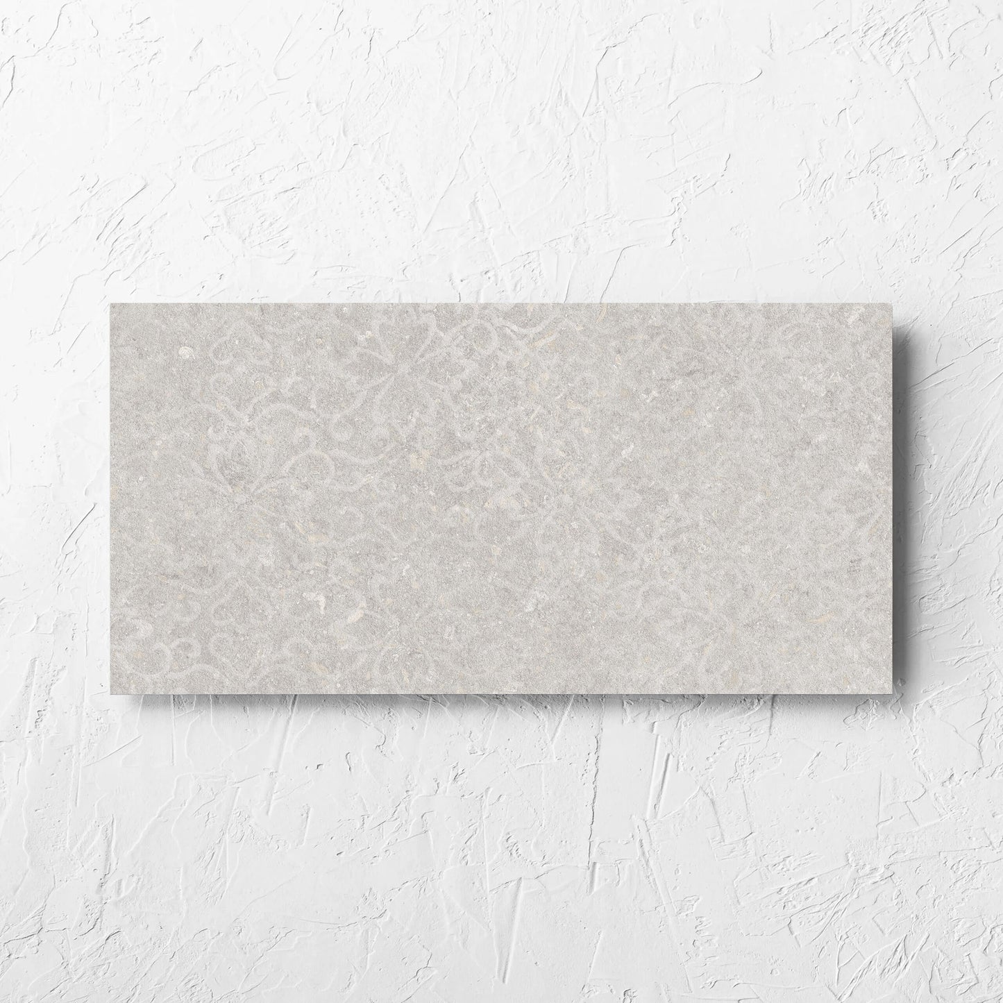 Brighton Stone Matt 300x600mm tile laid flat on a white rendered wall, showing the matt surface