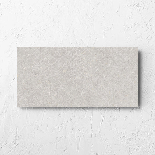 Brighton Stone Matt 300x600mm tile laid flat on a white rendered wall, showing the matt surface