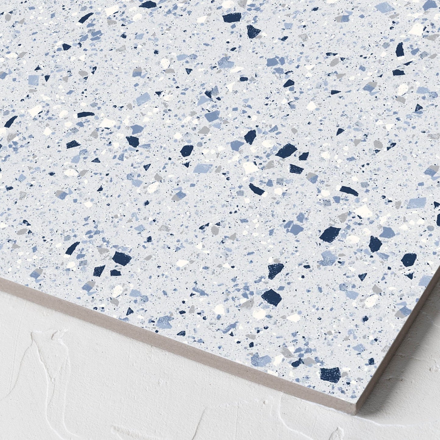 Corner close-up of the C Venice 300x300 Matt Blue Terrazzo Look Rectified tile showing the blue terrazzo look surface and the edge profile