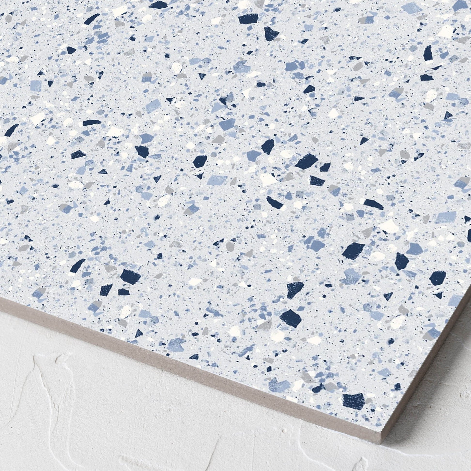 Corner close-up of the C Venice 300x300 Matt Blue Terrazzo Look Rectified tile showing the blue terrazzo look surface and the edge profile