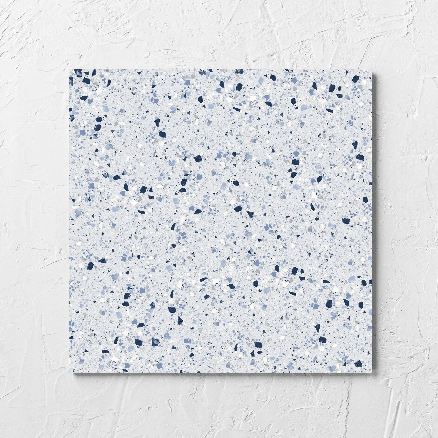 C Venice 300x300 Matt Blue Terrazzo Look Rectified tile laid flat on a white rendered wall, showing the blue terrazzo look surface