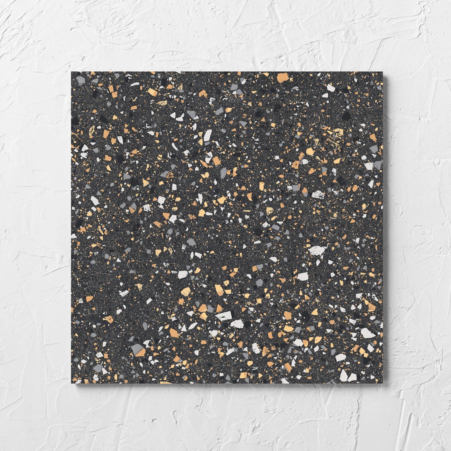 C Venice 300x300 Matt Graphite Terrazzo Look Rectified tile laid flat on a white rendered wall, showing the terrazzo look tiles surface
