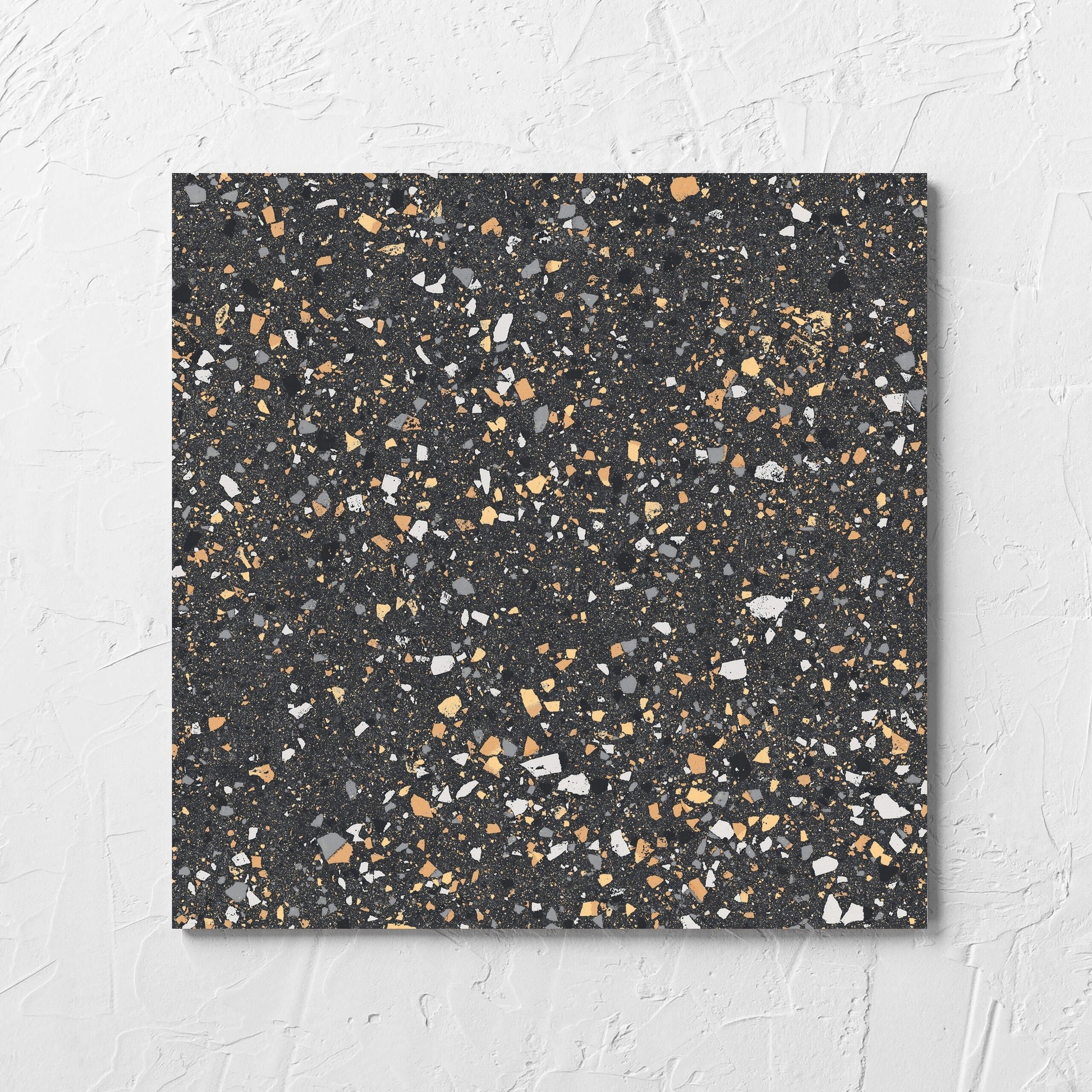 C Venice 300x300 Matt Graphite Terrazzo Look Rectified tile laid flat on a white rendered wall, showing the terrazzo look tiles surface