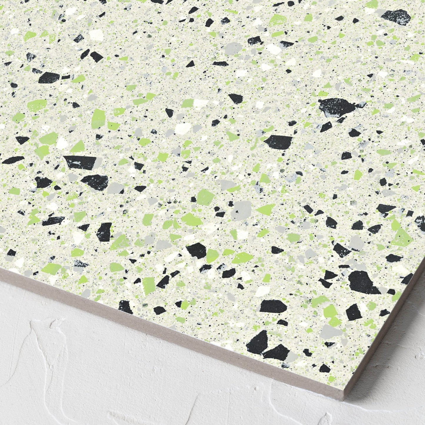 Corner close-up of the C Venice 300x300 Matt Green Terrazzo Look Rectified tile showing the tile surface and the edge profile