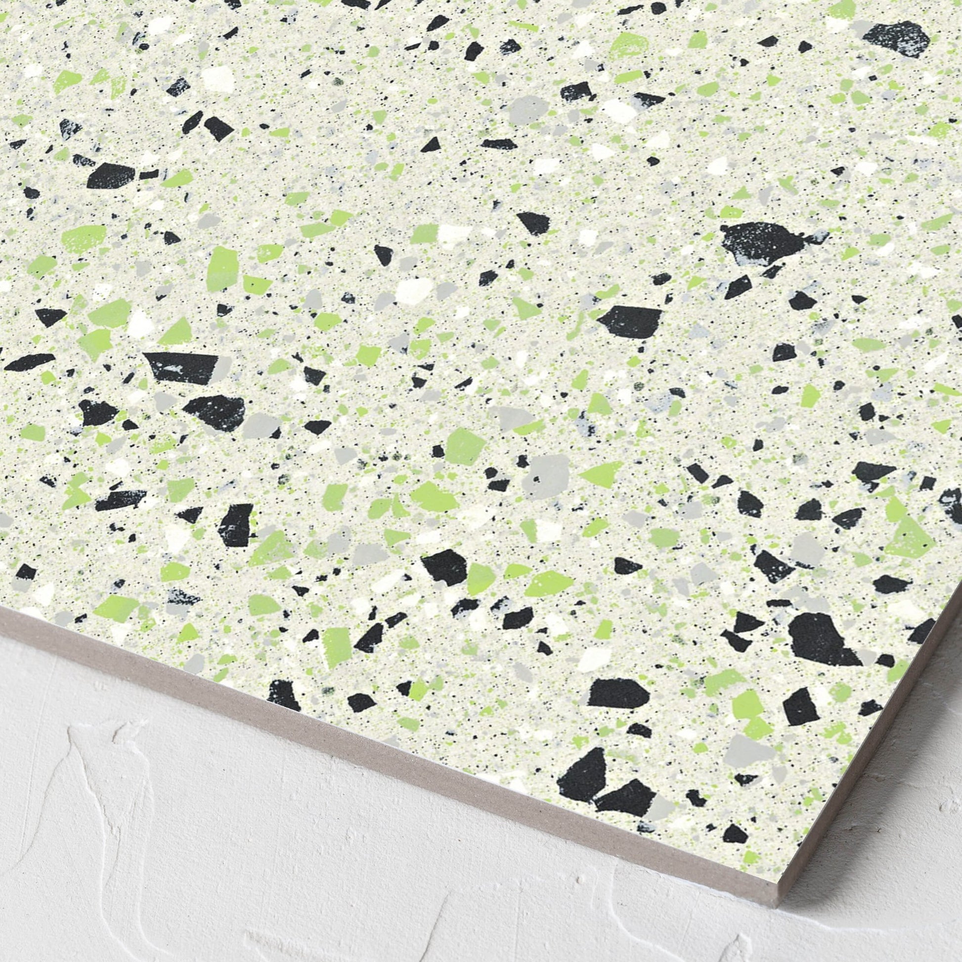 Corner close-up of the C Venice 300x300 Matt Green Terrazzo Look Rectified tile showing the tile surface and the edge profile