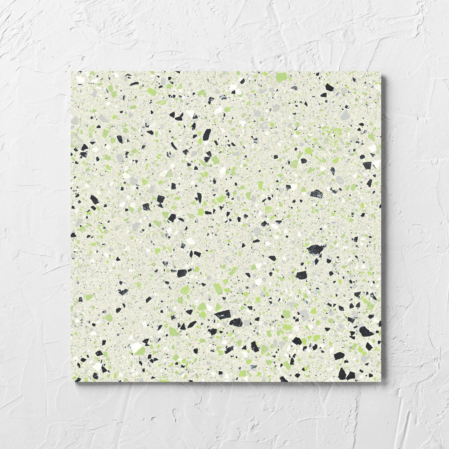 C Venice 300x300 Matt Green Terrazzo Look Rectified tile laid flat on a white rendered wall, showing the tile surface