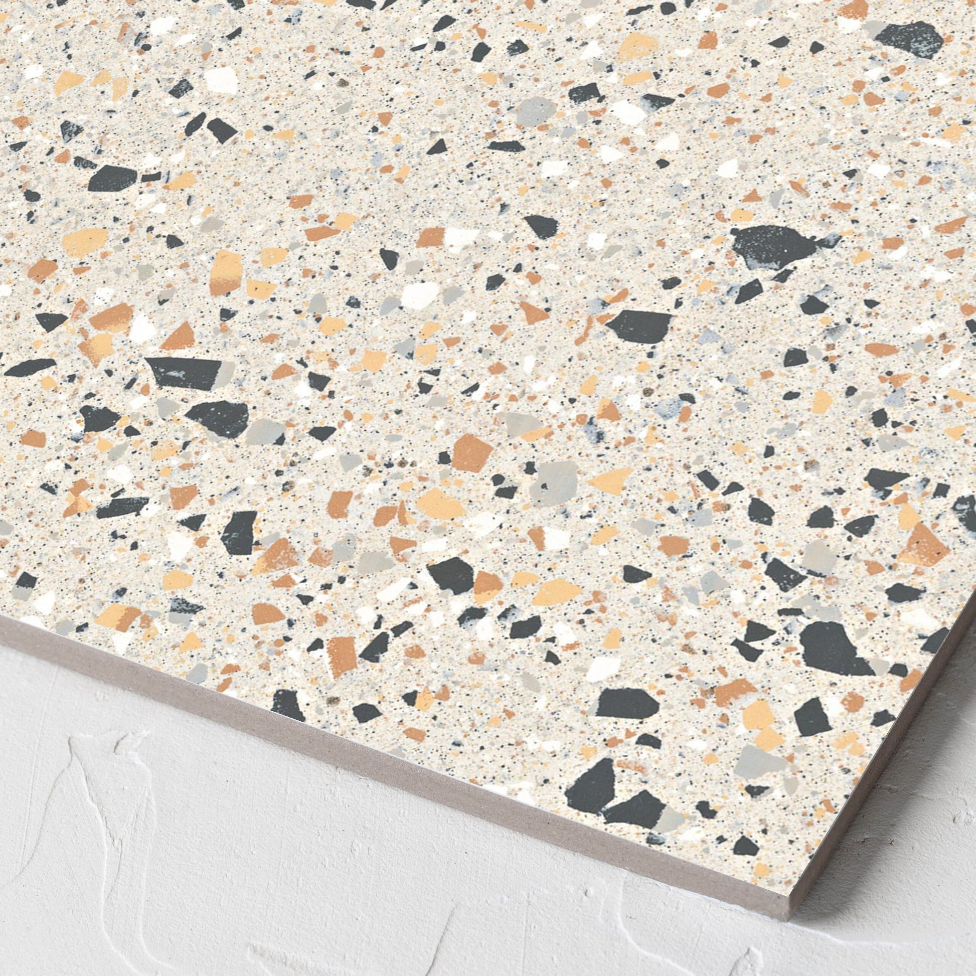 Corner close-up of the C Venice 300x300 Matt Ivory Terrazzo Look Rectified tile showing the tile surface and the edge profile
