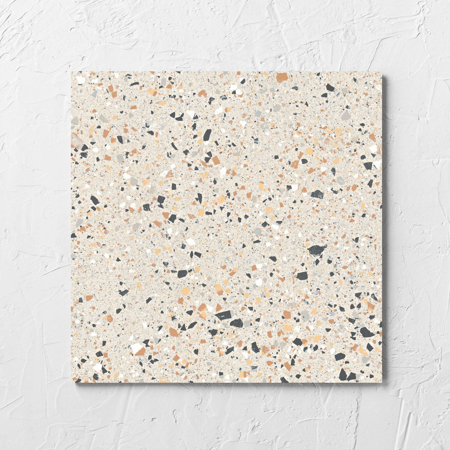 C Venice 300x300 Matt Ivory Terrazzo Look Rectified tile laid flat on a white rendered wall, showing the tile surface