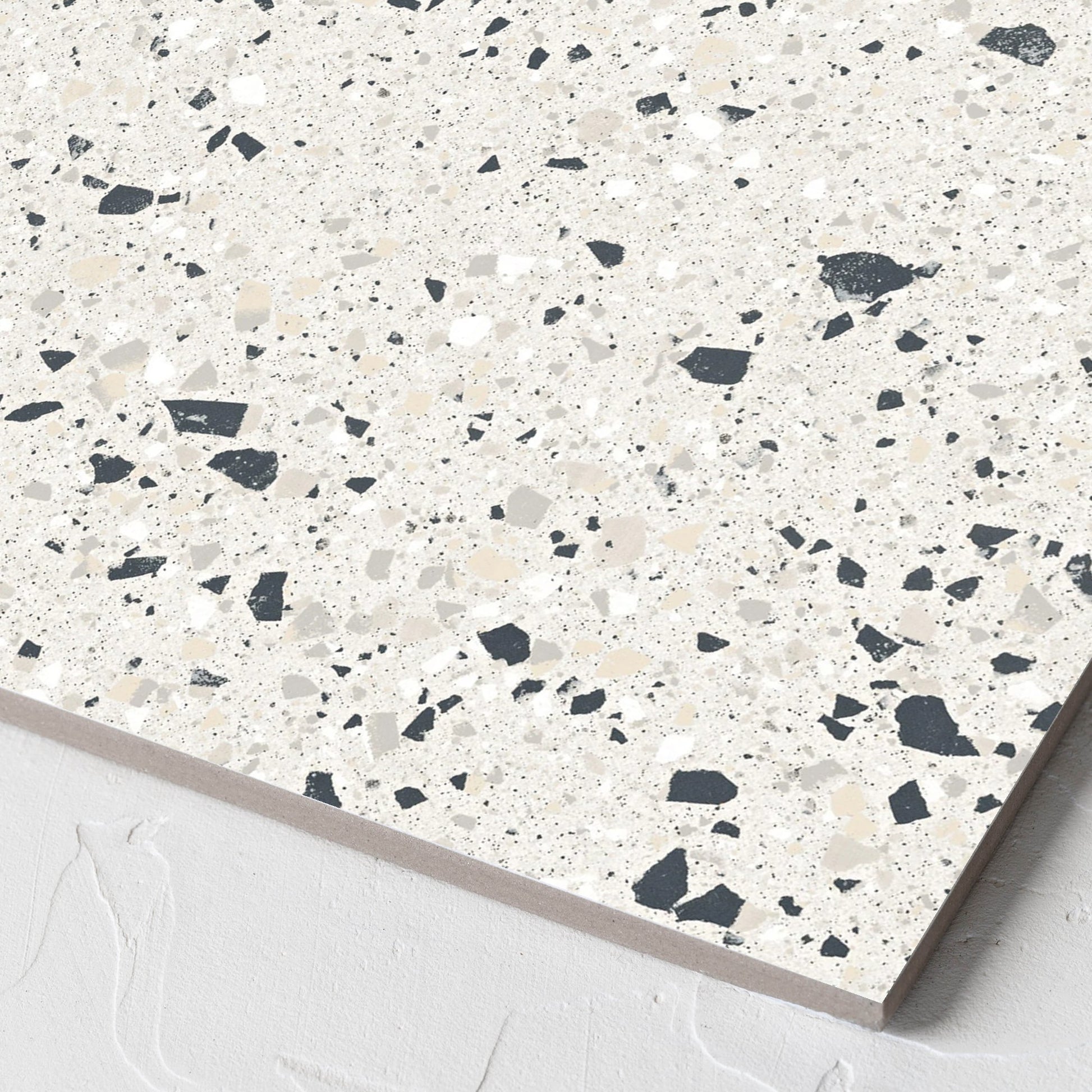 Corner close-up of the C Venice 300x300 Matt Silver Terrazzo Look Rectified tile showing the tile surface and the edge profile