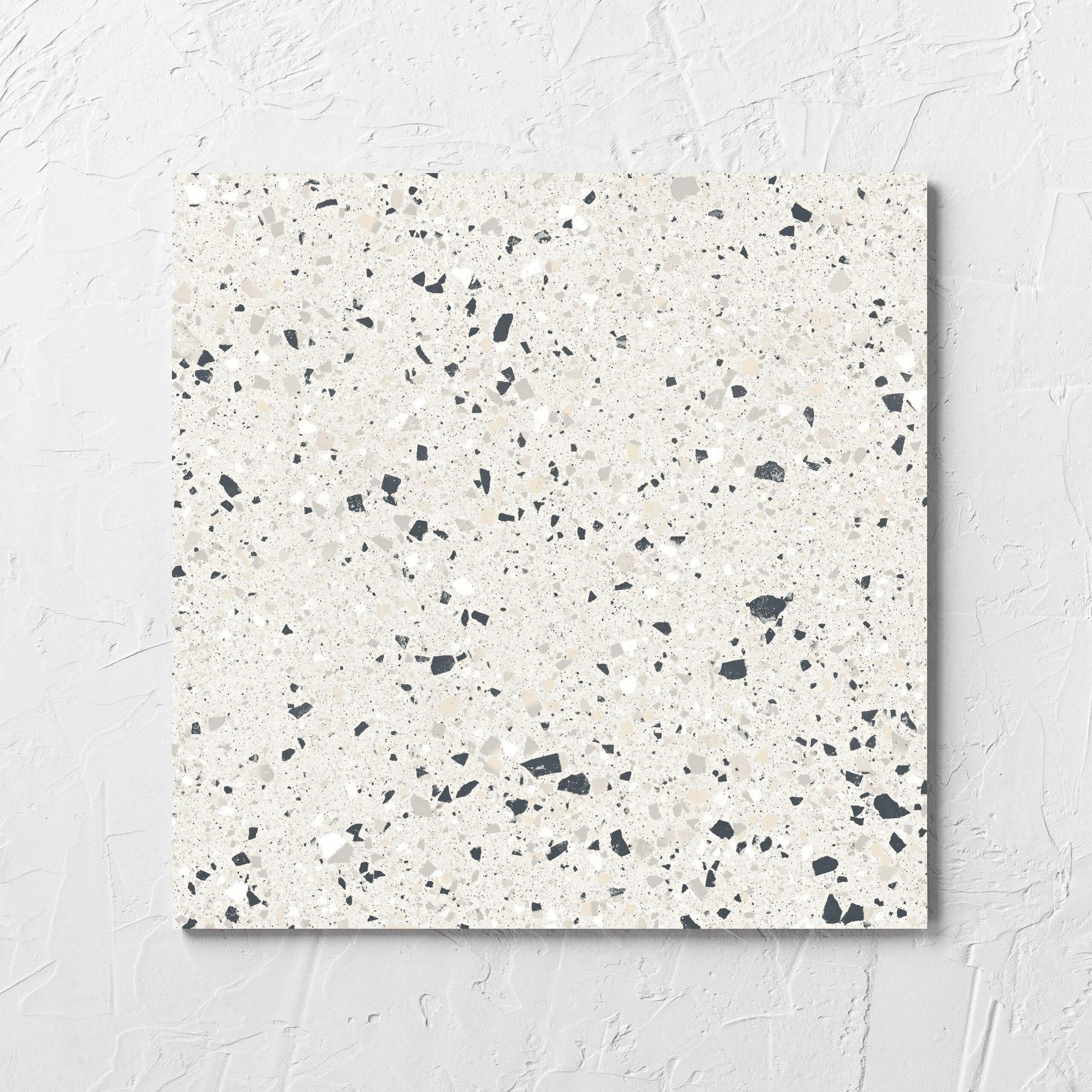 C Venice 300x300 Matt Silver Terrazzo Look Rectified tile laid flat on a white rendered wall, showing the tile surface