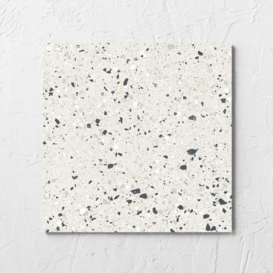 C Venice 300x300 Matt Silver Terrazzo Look Rectified tile laid flat on a white rendered wall, showing the tile surface