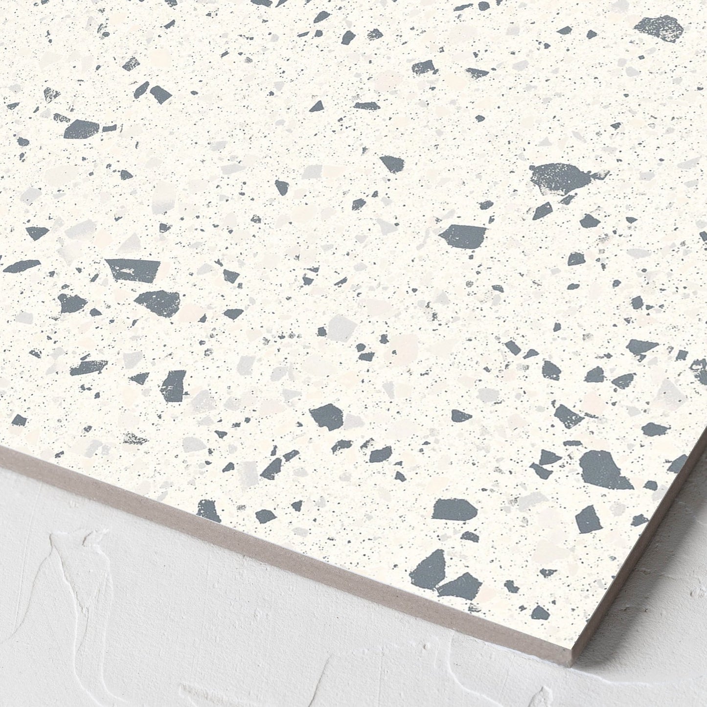 Corner close-up of the C Venice 300x300 Matt White Terrazzo Look Rectified tile showing the tile surface and the edge profile