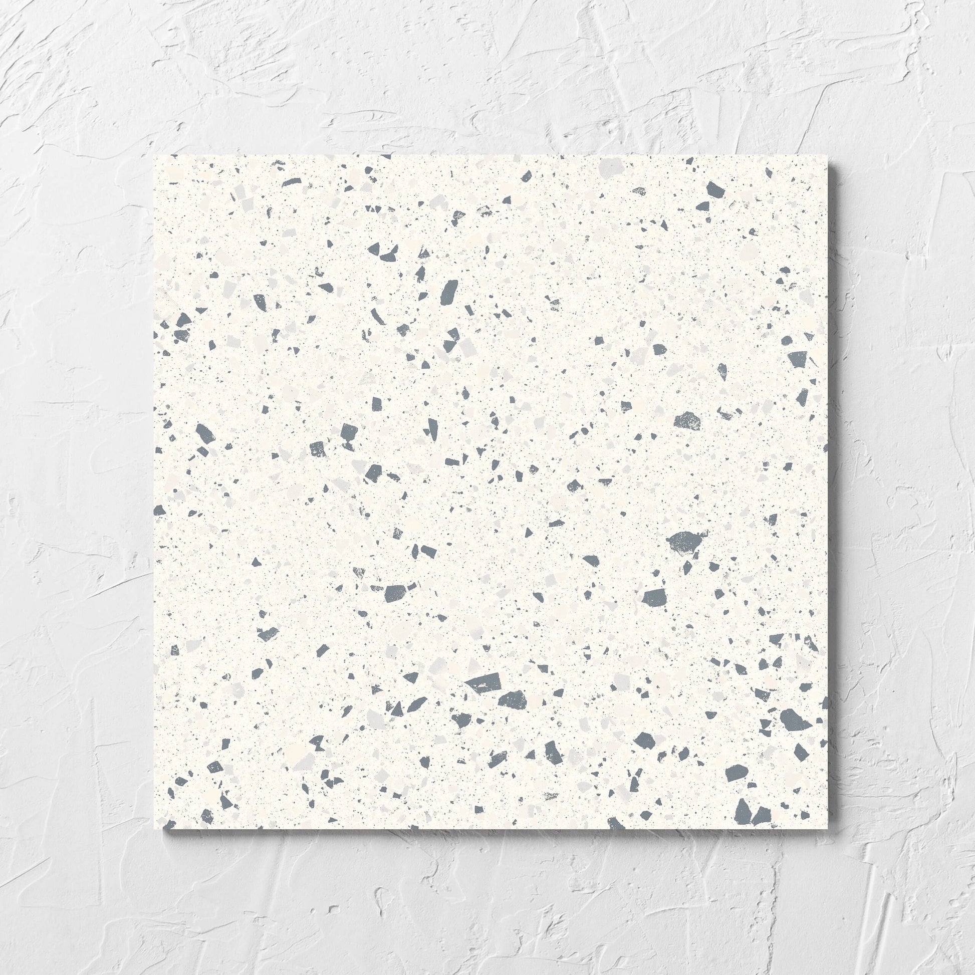 C Venice 300x300 Matt White Terrazzo Look Rectified tile laid flat on a white rendered wall, showing the tile surface