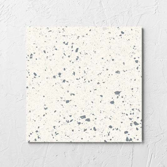 C Venice 300x300 Matt White Terrazzo Look Rectified tile laid flat on a white rendered wall, showing the tile surface