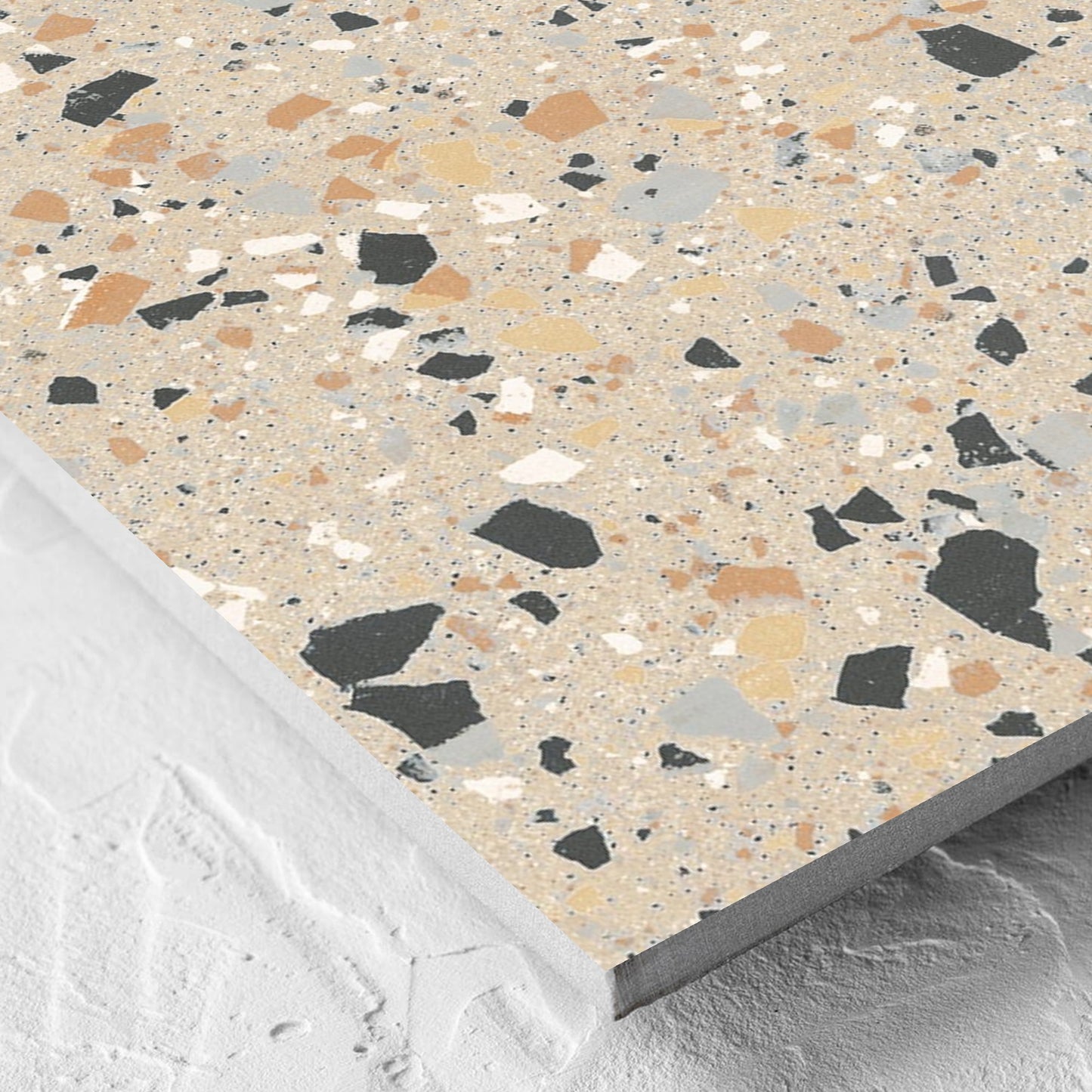 Corner close-up of the C Venice 600x600 Matt Beige Terrazzo Look Rectified tile showing the tile surface and the edge profile