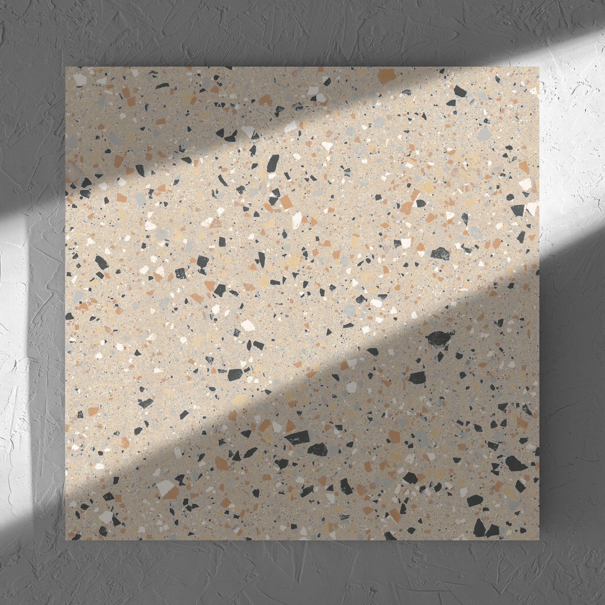 C Venice 600x600 Matt Beige Terrazzo Look Rectified tile in soft natural window light, showing the tile surface