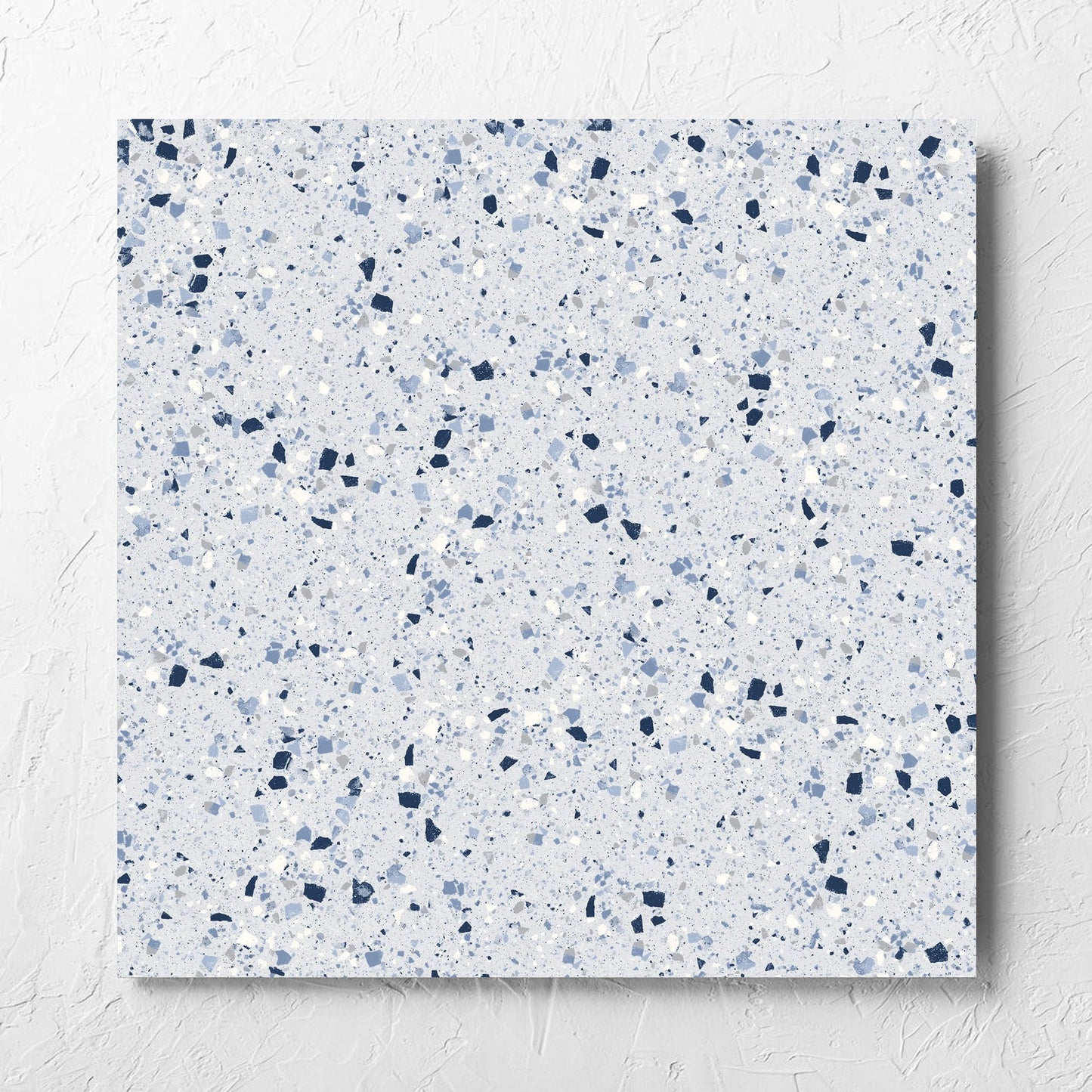 C Venice 600x600 Matt Blue Terrazzo Look Rectified tile laid flat on a white rendered wall, showing the tile surface