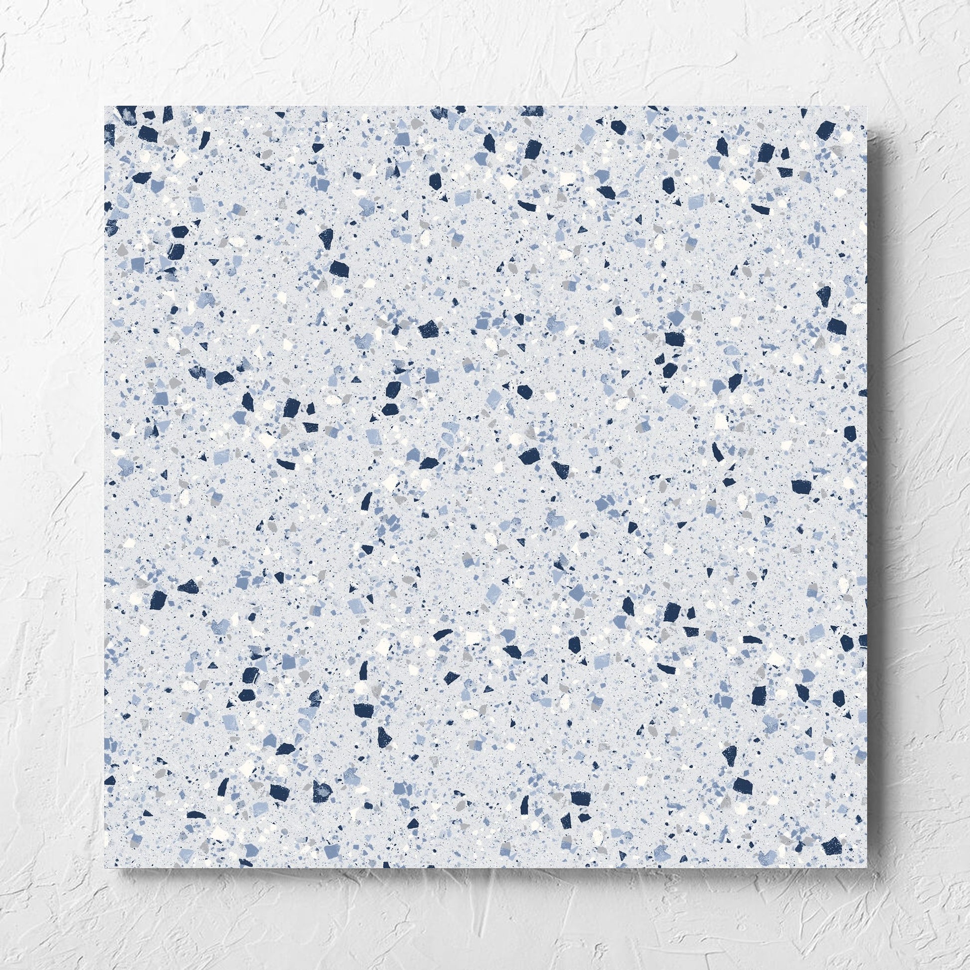 C Venice 600x600 Matt Blue Terrazzo Look Rectified tile laid flat on a white rendered wall, showing the tile surface
