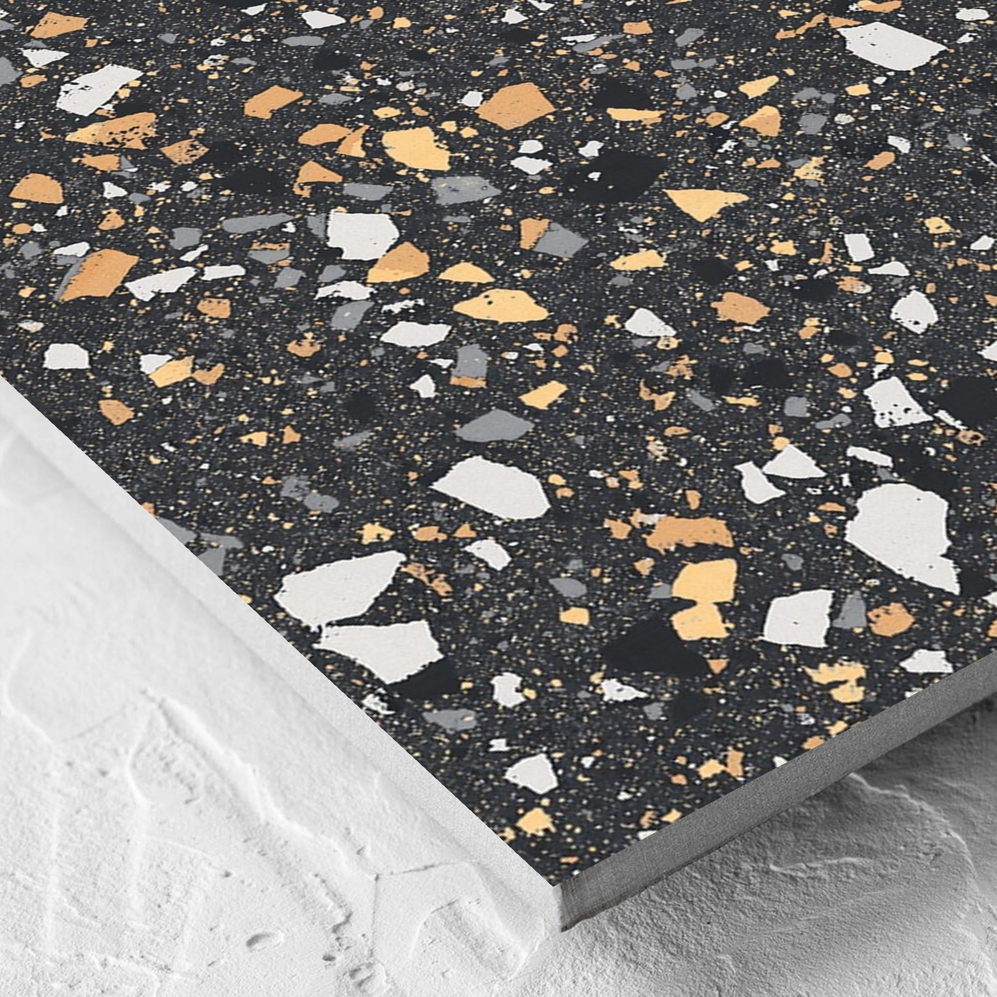 Corner close-up of the C Venice 600x600 Matt Graphite Terrazzo Look Rectified tile showing the tile surface and the edge profile