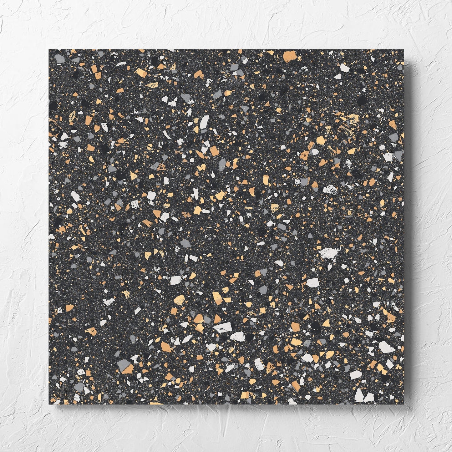 C Venice 600x600 Matt Graphite Terrazzo Look Rectified tile laid flat on a white rendered wall, showing the tile surface