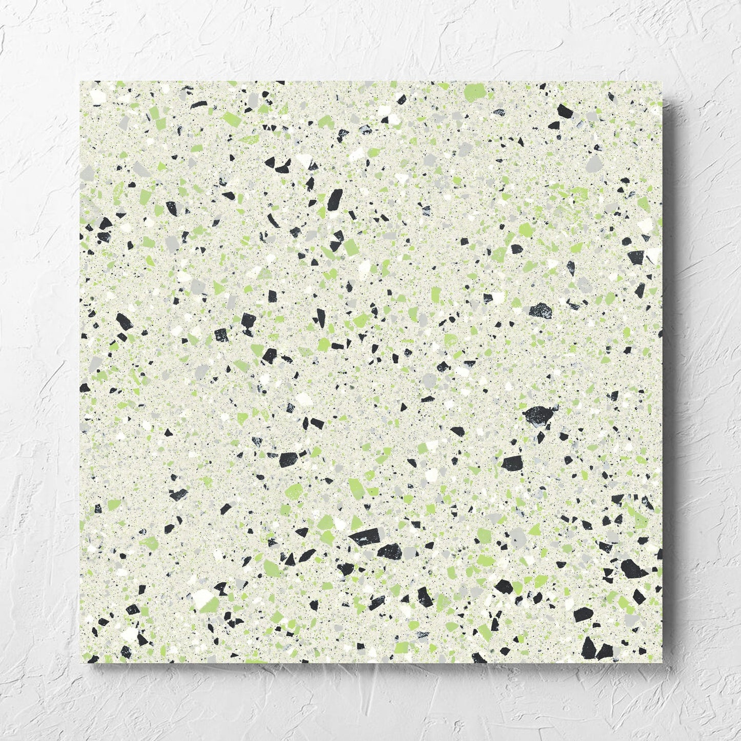 C Venice 600x600 Matt Green Terrazzo Look Rectified tile laid flat on a white rendered wall, showing the tile surface