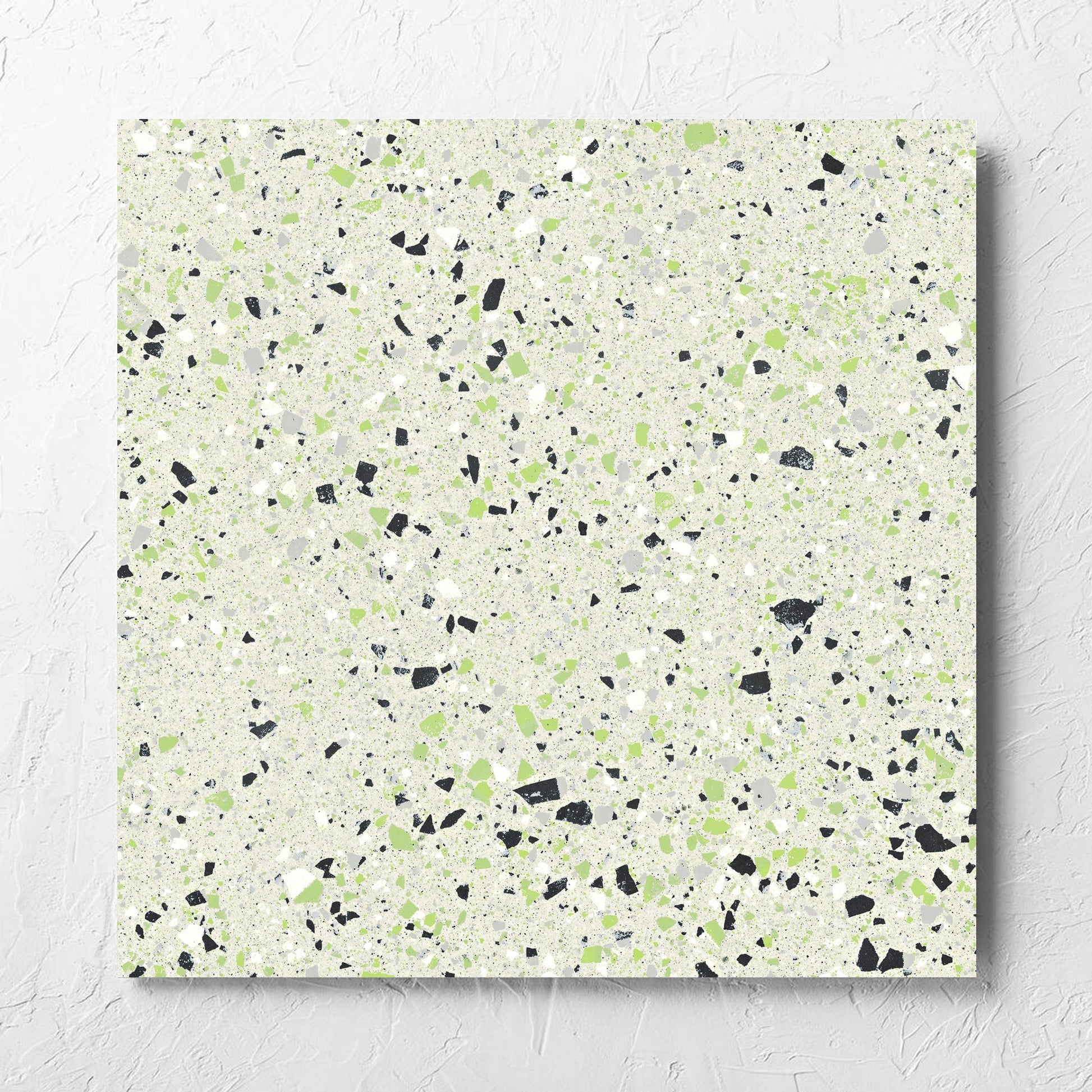 C Venice 600x600 Matt Green Terrazzo Look Rectified tile laid flat on a white rendered wall, showing the tile surface