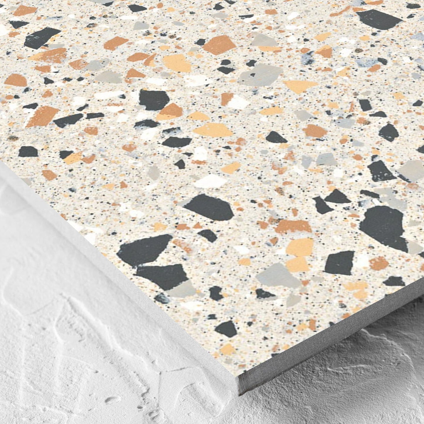 Corner close-up of the C Venice 600x600 Matt Ivory Terrazzo Look Rectified tile showing the tile surface and the edge profile