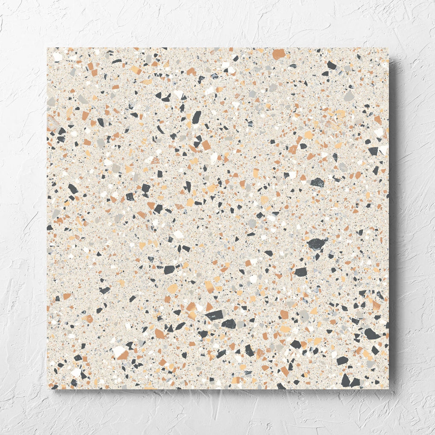 C Venice 600x600 Matt Ivory Terrazzo Look Rectified tile laid flat on a white rendered wall, showing the tile surface