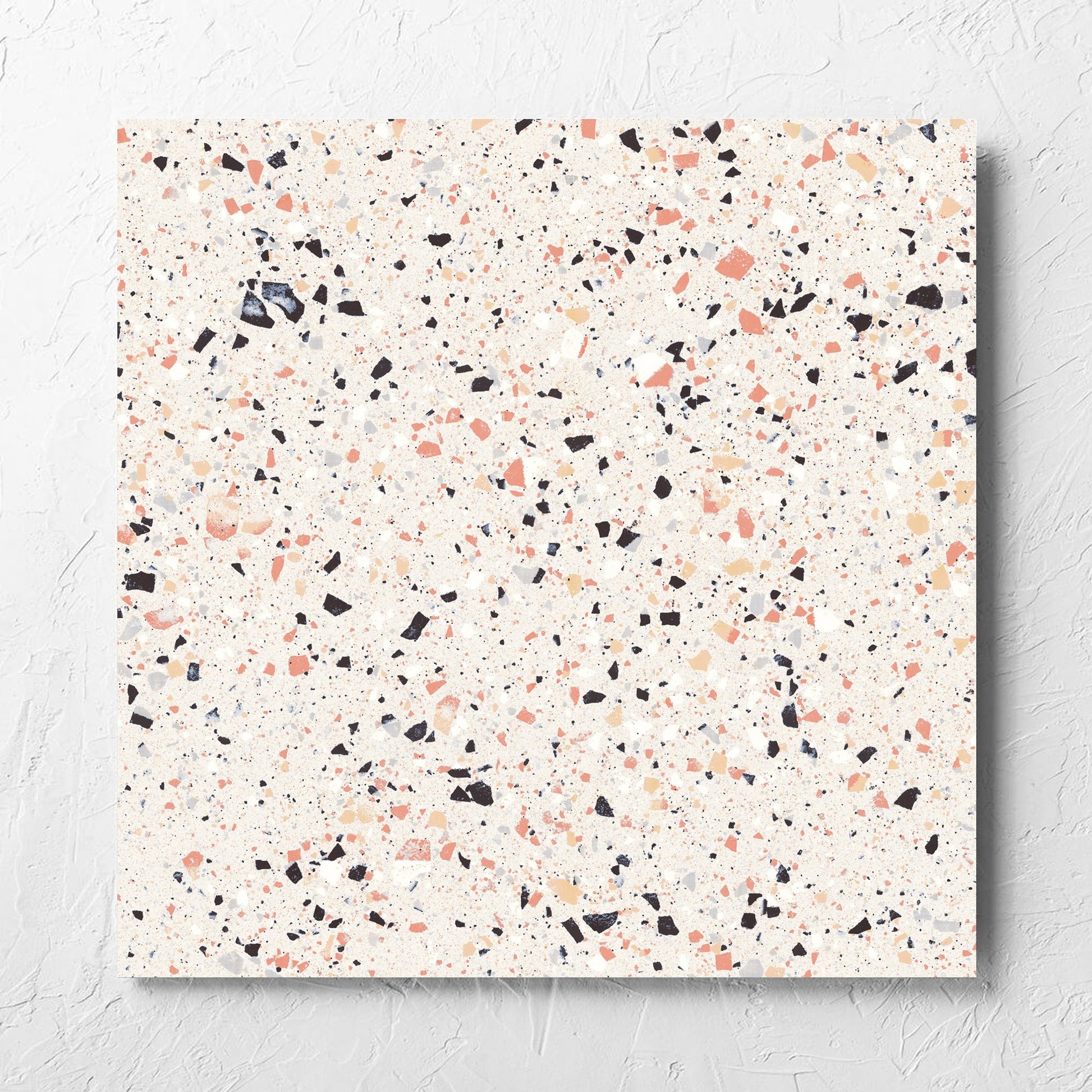 C Venice 600x600 Matt Pink Terrazzo Look Rectified tile laid flat on a white rendered wall, showing the pink matt surface