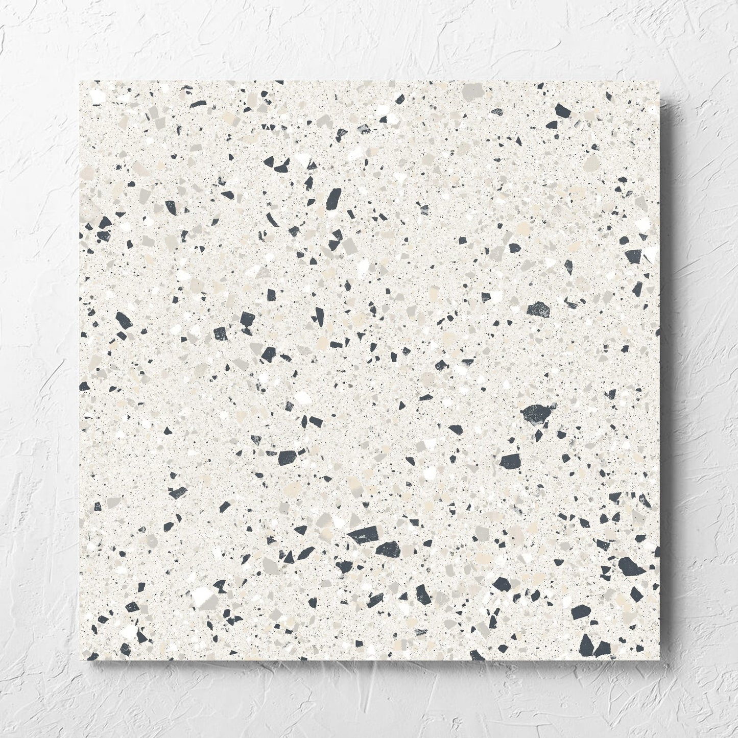 C Venice 600x600 Matt Silver Terrazzo Look Rectified tile laid flat on a white rendered wall, showing the tile surface