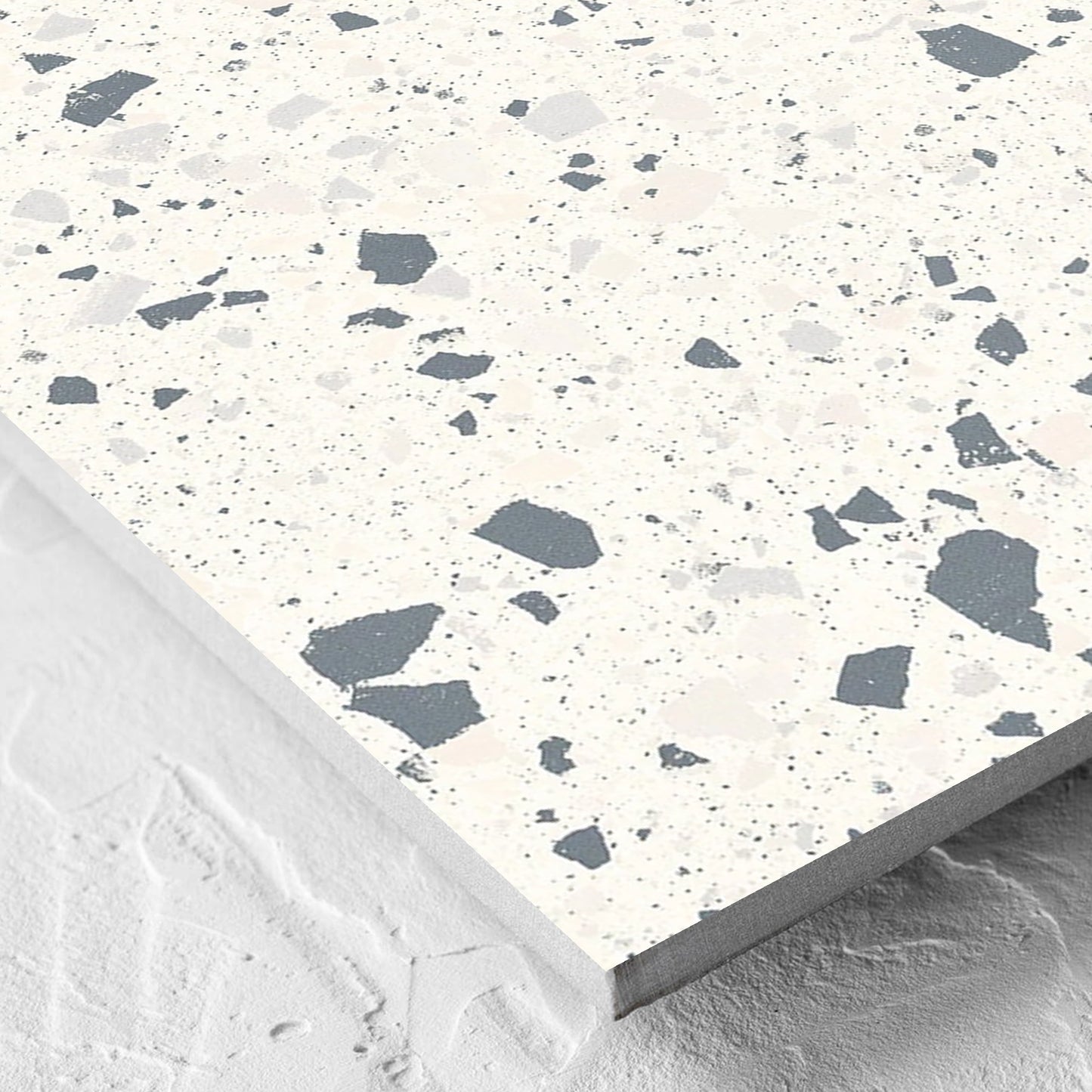 Corner close-up of the C Venice 600x600 Matt White Terrazzo Look Rectified tile showing the tile surface and the edge profile
