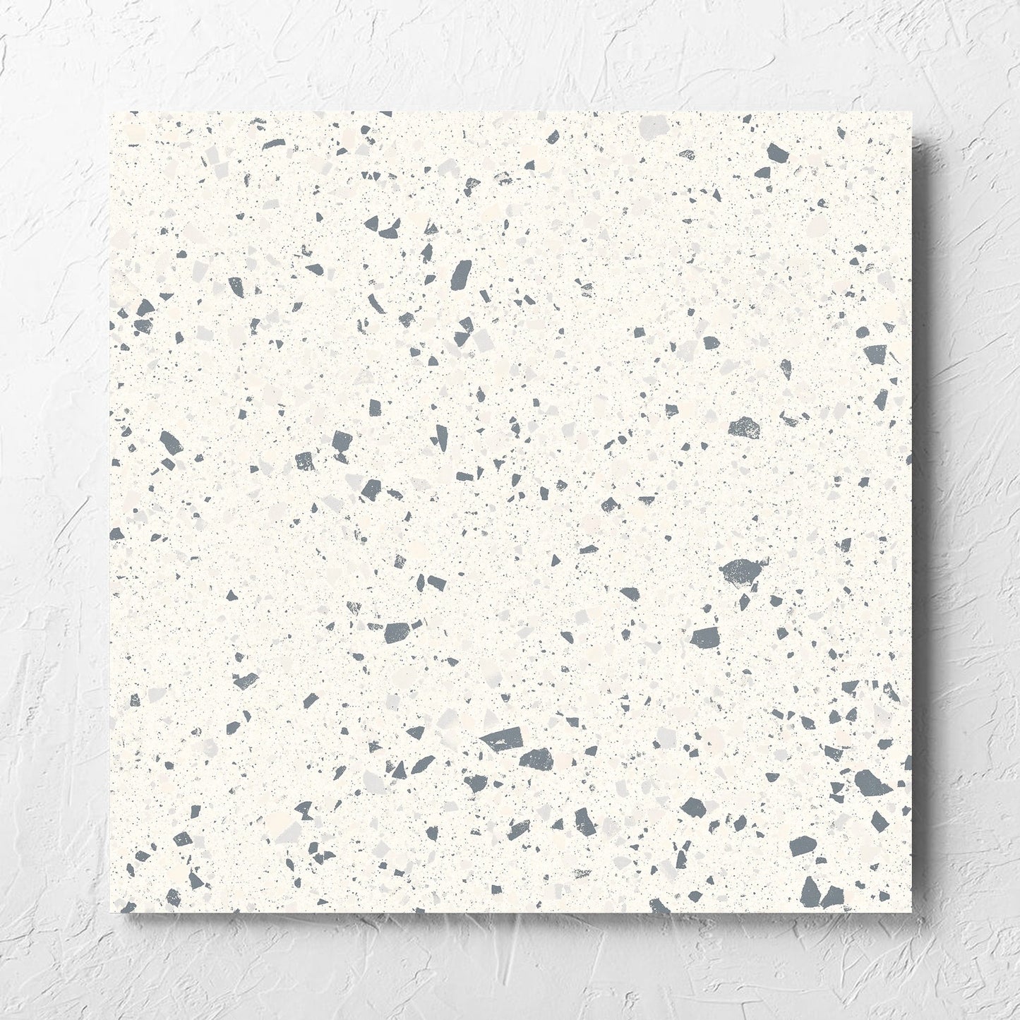 C Venice 600x600 Matt White Terrazzo Look Rectified tile laid flat on a white rendered wall, showing the tile surface