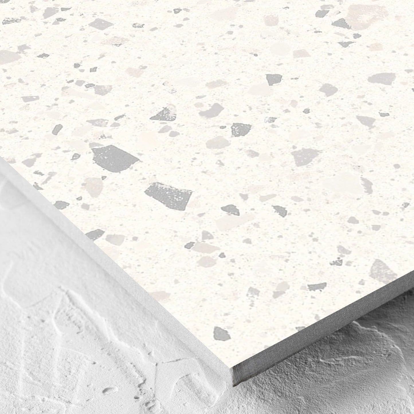Corner close-up of the C Venice 600x600 Matt Zinc Terrazzo Look Rectified tile showing the tile surface and the edge profile